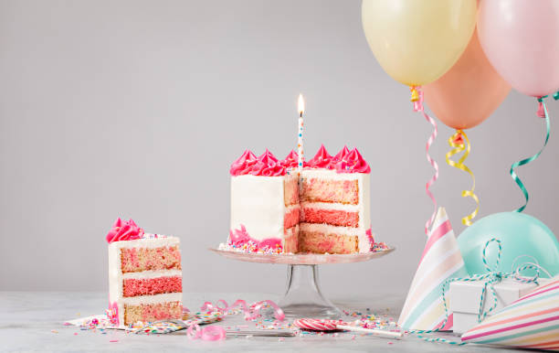istock Birthday Party with Sliced Pink Cake 1368439281