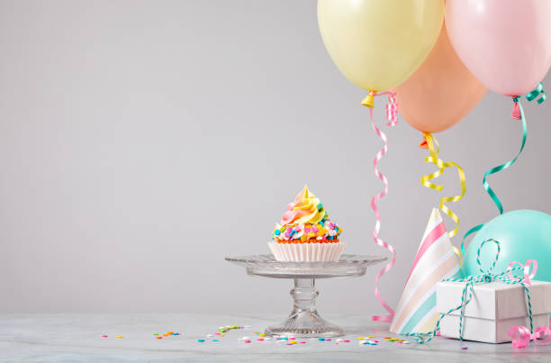 istock Rainbow Birthday Party Cupcake with Sprinkles 1368439416