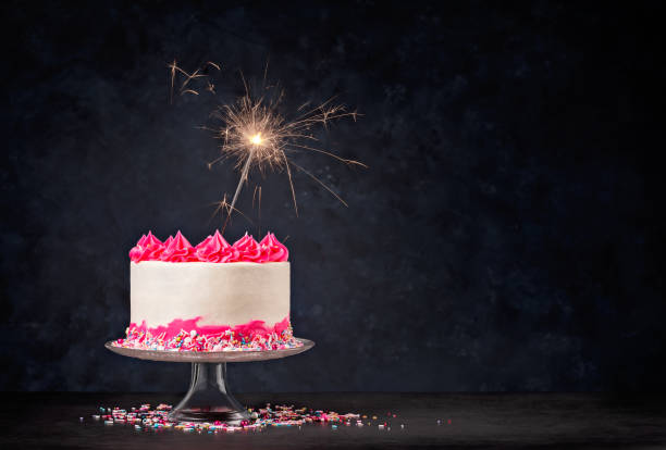 istock Pink Birthday Cake with Sparkler 1368439837