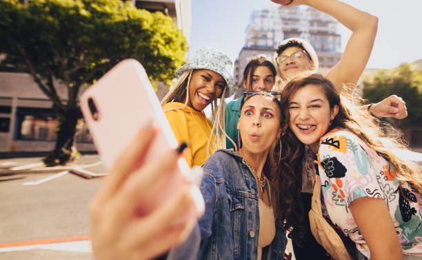istock Vibrant young people taking a selfie together 1368443184