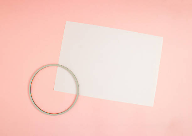 istock Circle frame and FLYER A4 mock up blank template design idea. Circle frame mockup against pastel pink background. Copy space templates designs for message. 3D illustration layout. 1368445706