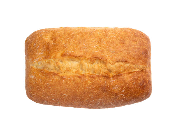 ciabatta è isolata su uno sfondo bianco. pane italiano a base di farina di frumento. cottura vista dall'alto, dall'alto. - ciabatta foto e immagini stock