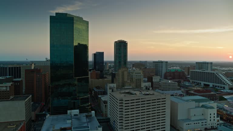 Aerial establishing shot of Fort Worth, Texas at sunset on a summer evening.