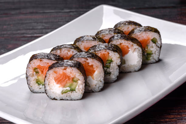 istock Traditional delicious fresh sushi roll set on a white background 1368450857