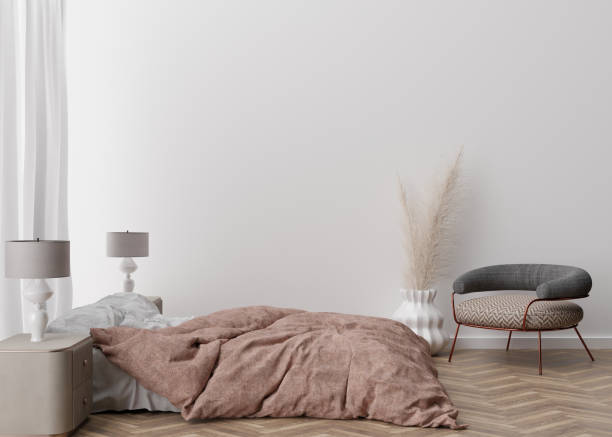 istock Empty white wall in modern and cozy bedroom. Mock up interior in contemporary style. Free space, copy space for your picture, text, or another design. Bed, lamps, parquet, pampas grass. 3D rendering. 1368451314