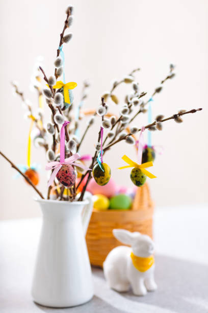 istock festive table decoration for Easter holiday with flowers and egg basket and rabbit figurine 1368452318