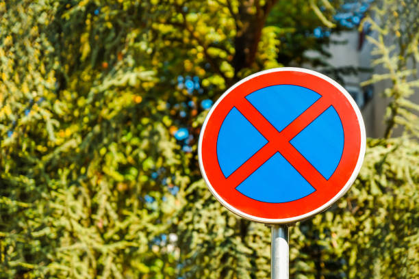 No Stopping and No parking sign on tree background