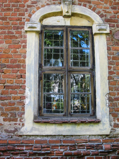 istock fragment of an old brick wall with an old window 1368453637
