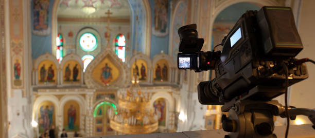 istock television camera in an orthodox church , television broadcasts 1368454964