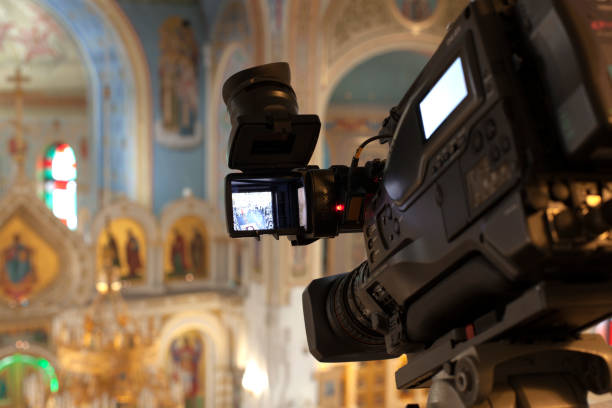 istock television camera in an orthodox church , television broadcasts 1368454967