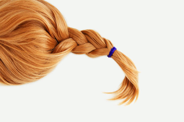 istock Redhead a blond wig hair braided braid. White background. 1368455790