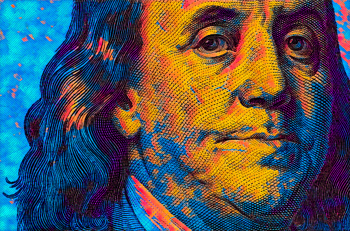 colored 100 dollar banknote fragment for design purpose. Benjamin Franklin closeup