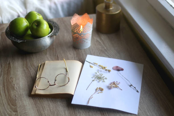istock Book, Glasses, Herbarium, Apples and Candle 1368456918