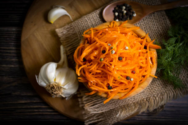 istock korean carrots on wooden background 1368459928