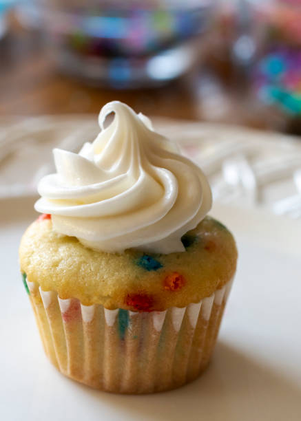 istock A close up view of a mini cupcake decorated with white icing. 1368460177