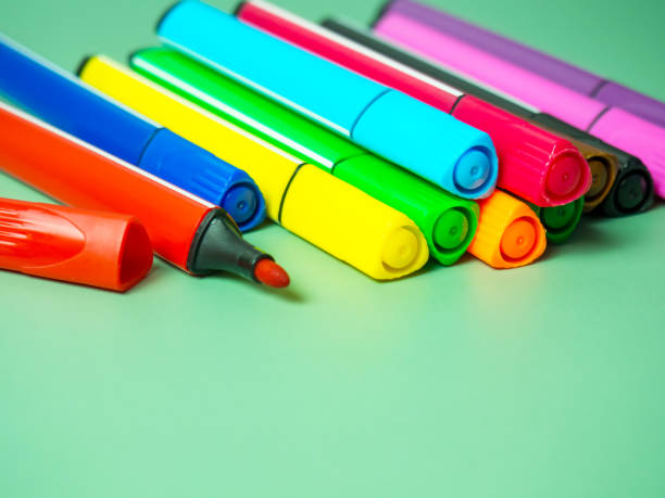 istock A set of multicolor felt-tip pens, multi-colored felt-tip pens on a green background with space for text 1368464478
