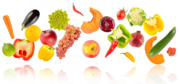 istock Falling colorful vegetables and fruits with light reflection isolated on white 1368464525