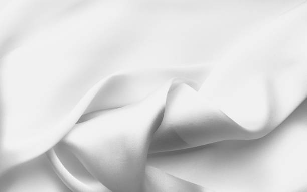istock White satin silk, elegant fabric for backgrounds 1368464721