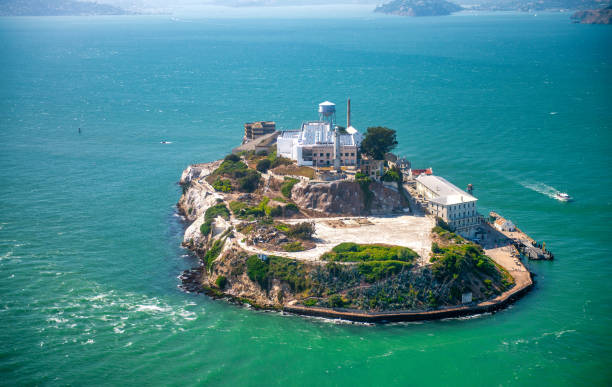 Alcatraz Island and Prison, aerial view from helicopter on a clear sunny day. Alcatraz Island and Prison, aerial view from helicopter on a clear sunny day alcatraz island photos stock pictures, royalty-free photos & images