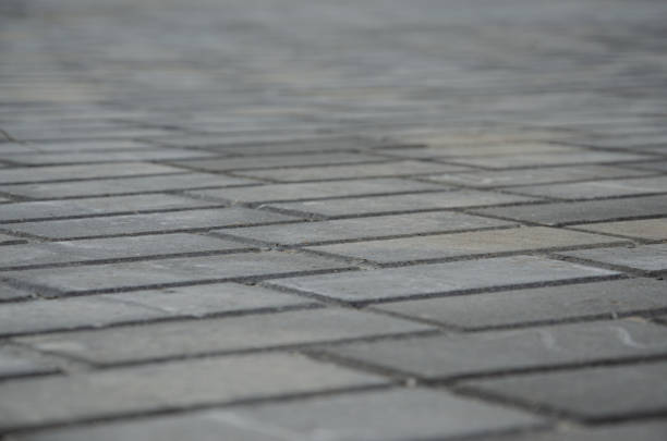 istock Brick texture footpath on walk with perspective going into the distance. 1368468170