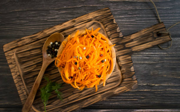 istock korean carrots on wooden background 1368468631