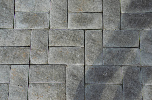 istock Abstract background. Old cobblestone pavement close-up. City 1368468903