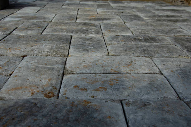 istock Abstract background. Old cobblestone pavement close-up. City 1368468953