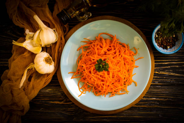 istock korean carrots on wooden background 1368472689