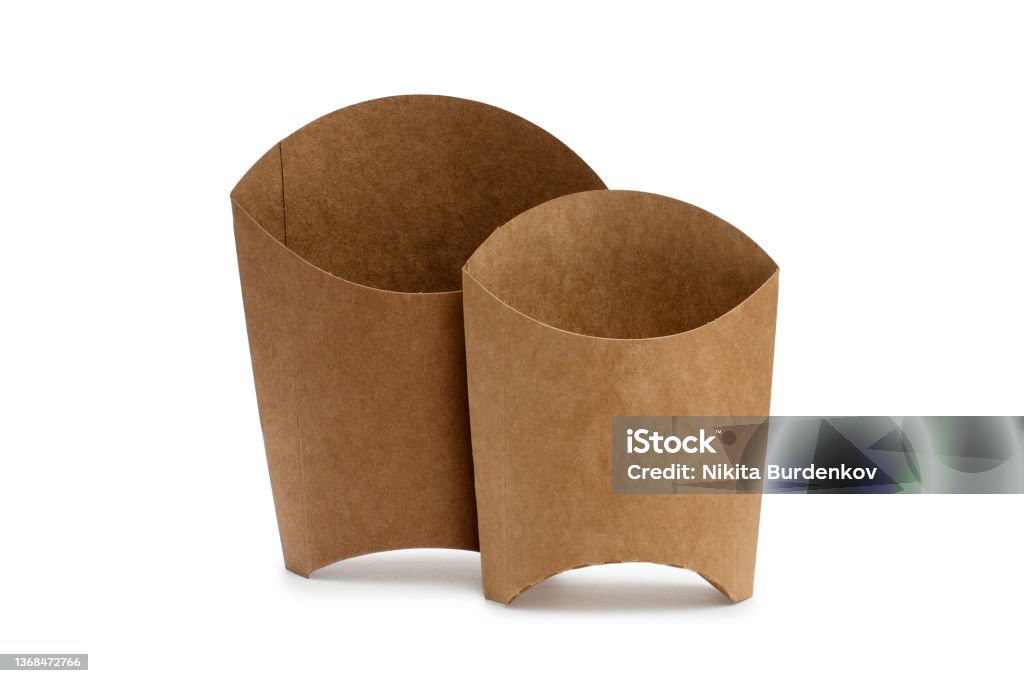 Two boxes for french fries of different sizes on a white background. Brown cardboard boxes. Two boxes for french fries of different sizes on a white background. Brown cardboard boxes. Isolated objects, logo template. Food Stock Photo