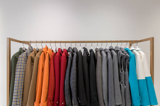 istock Clothes on hangers, women's multicolored coats 1368473397