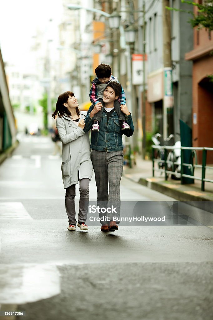 Japanese family outing Japanese family walking dow the street Adult Stock Photo