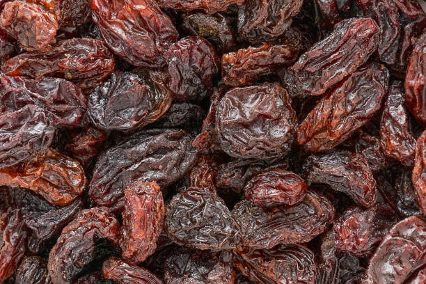 istock Dark raisins as background. Top view, food background 1368475871