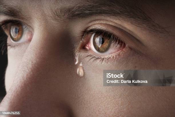 Closeup Of Young Crying Man Eyes With A Tears Stock Photo - Download Image Now - Teardrop, Crying, Men