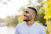 istock Young smiling athlete in public park 1368477551