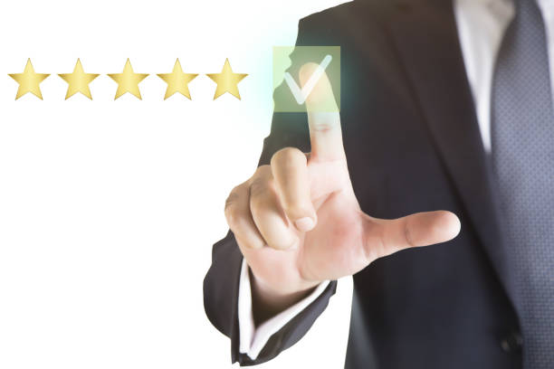 istock Businessman touching virtual screen on satisfaction rating icon 1368478360