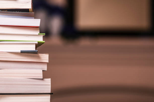 istock Background, stack of books in home office, school, or coffee table. 1368480007