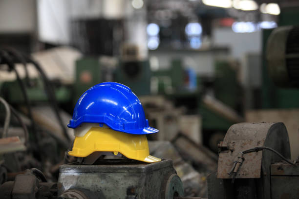 istock yellow and blue safety hat for working industry area 1368480684