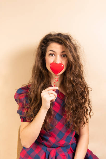 istock Beautiful woman holding hearth. Love concept 1368481011