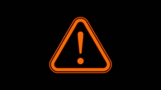 Blinking Yellow Warning symbol loop animation footage on black solid background. 2d