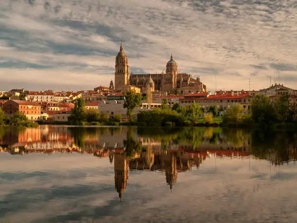 Salamanca Cathedral reflected on Tormes River during a Sunset on September 2006, Spain.
