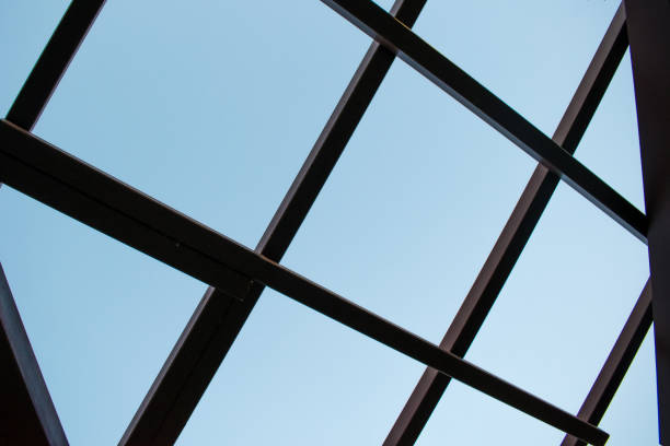 istock Crossed roof bars and blue sky 1368489733