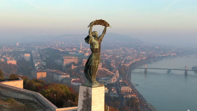 Aerial View of Budapest Cityscape Including Historical Landmark Liberty Statue on Gellert Hill at Sunrise