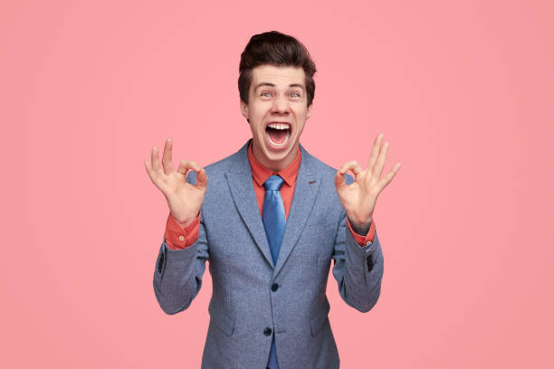 istock Excited comic businessman showing OK gesture 1368491537