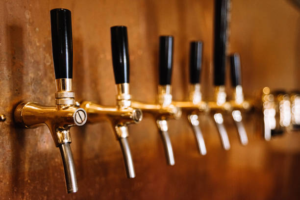 istock beer tap many in a row bar interior copper wall 1368494320