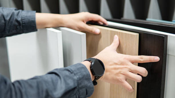 istock Male hand choosing cabinet or countertop materials 1368495252