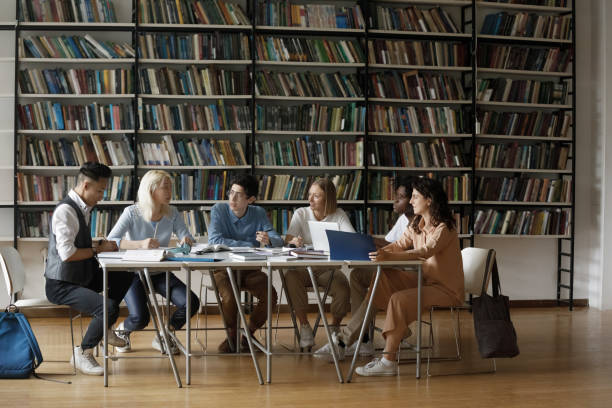 istock Diverse multiethnic group of students cooperating on graduation project 1368496781
