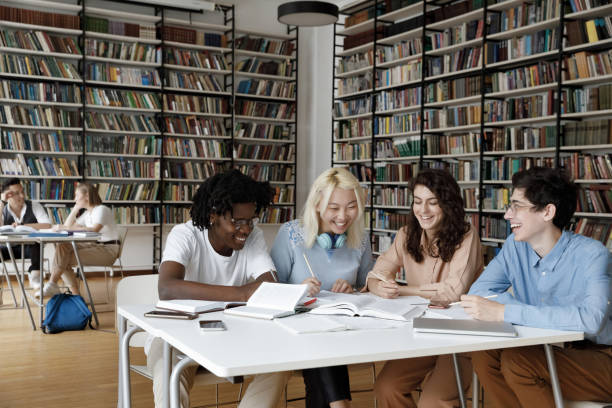 istock Mixed race group of students enjoying working together 1368496787