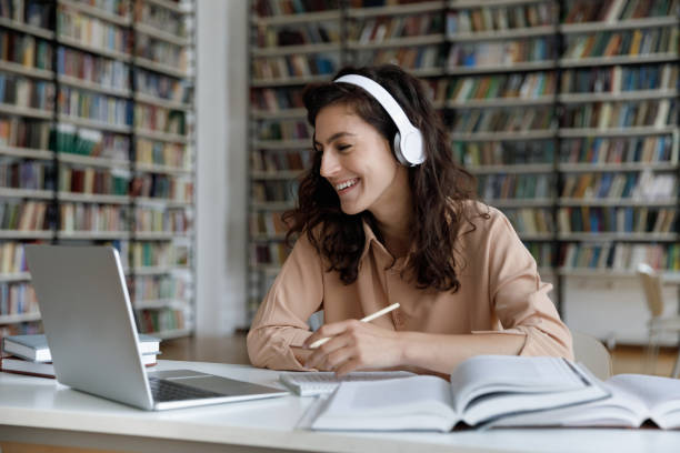 istock Happy engaged gen Z student girl watching webinar 1368496861