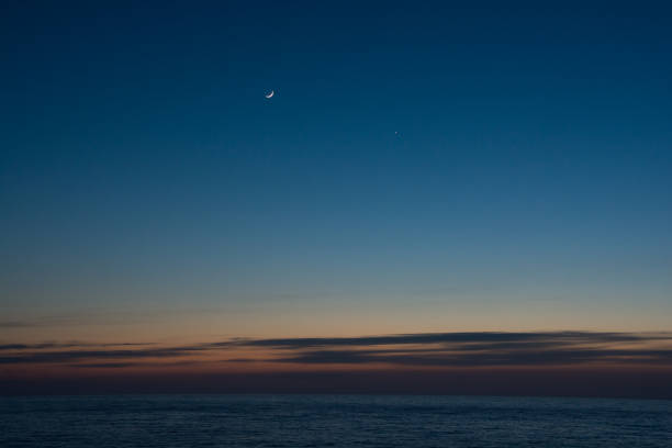 istock Crescent and Venus in the beautiful sea dusk sky 1368501676