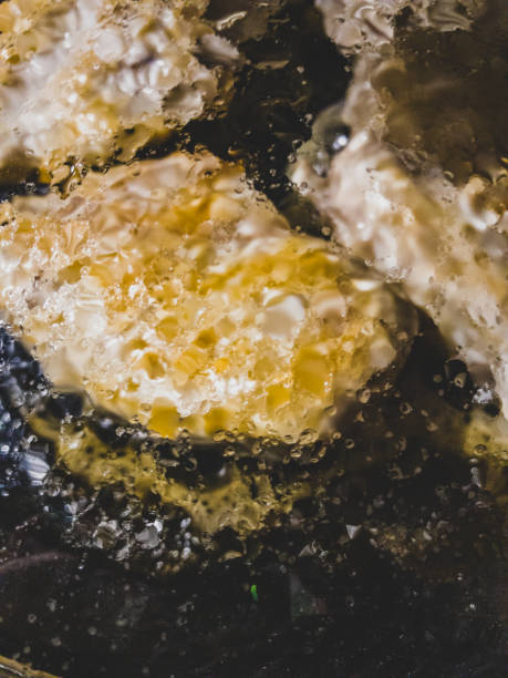 istock Chicken breast fillets on frying in a pan. 1368503345
